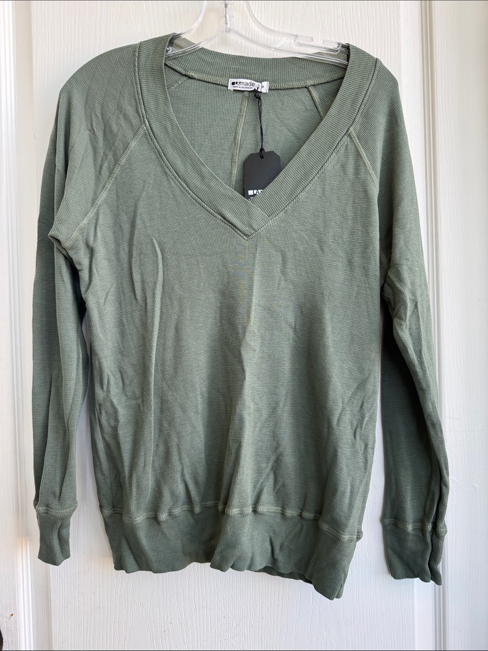 LAmade olive green V-neck long-sleeve top.